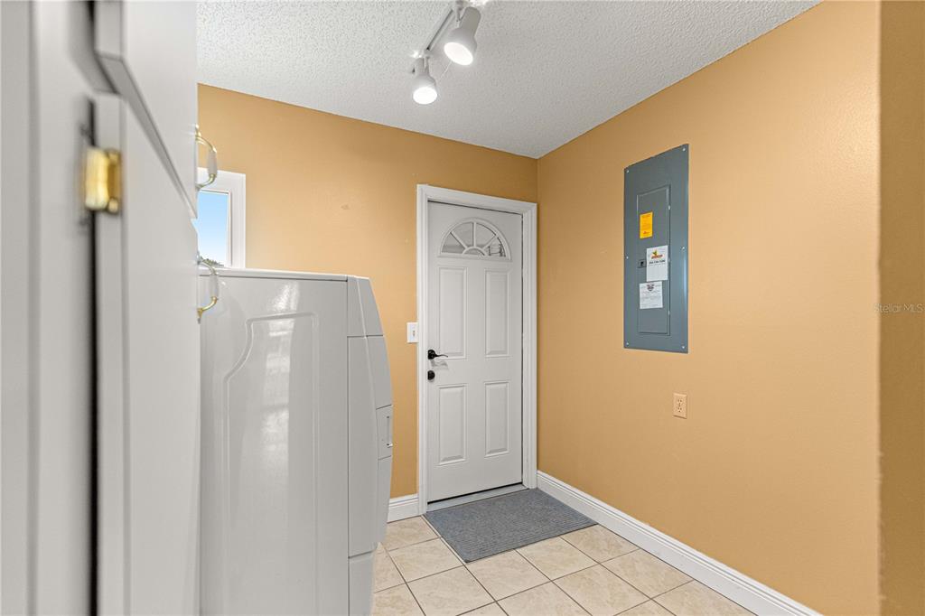 8470 Southwest 107th Place Ocala, FL 34481 - Photo 22 of 44 a view of an entryway with wooden floor