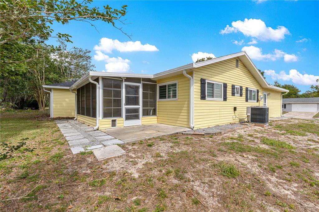 8470 Southwest 107th Place Ocala, FL 34481 - Photo 36 of 44 a house view with a garden space