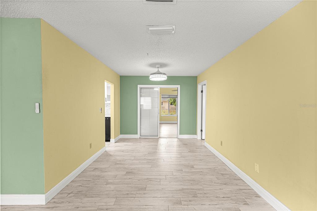 8470 Southwest 107th Place Ocala, FL 34481 - Photo 4 of 44 a view of hallway with wooden floor
