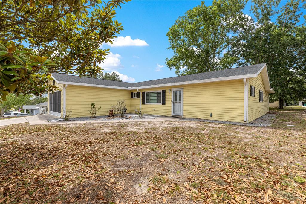 8470 Southwest 107th Place Ocala, FL 34481 - Photo 42 of 44 a view of house with backyard and space