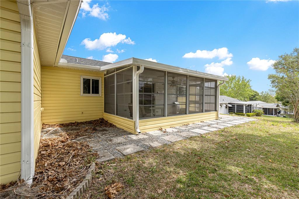 8470 Southwest 107th Place Ocala, FL 34481 - Photo 43 of 44 a view of a house with a backyard
