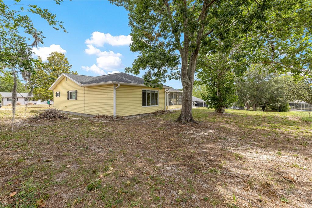 8470 Southwest 107th Place Ocala, FL 34481 - Photo 44 of 44 a view of a house with backyard and tree