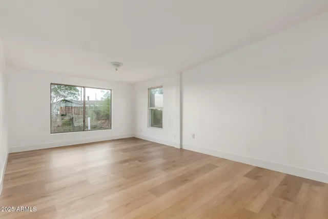 a kitchen with granite countertop a refrigerator oven a sink dishwasher and a refrigerator