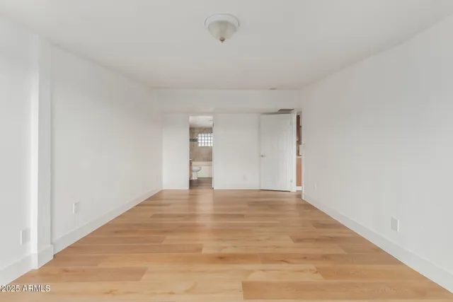 an empty room with large window