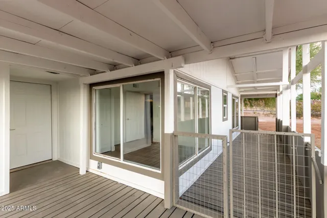 a view of a house with a backyard and mountain view