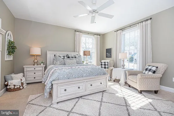 a bathroom with a toilet and a mirror