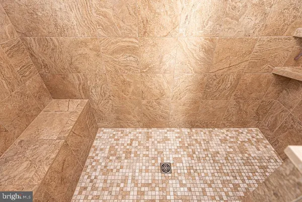 a bedroom with a bed and a book shelf