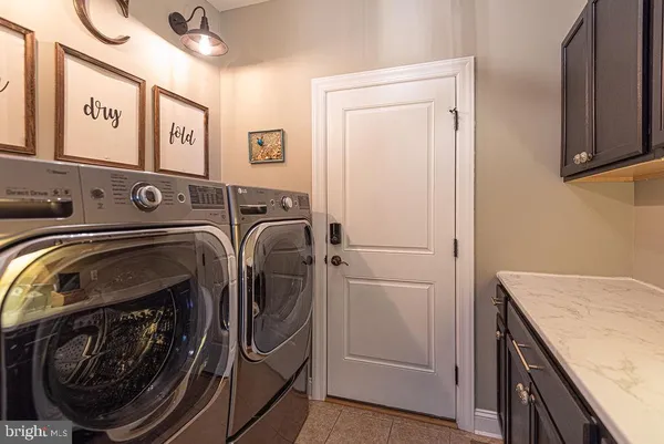 a bathroom with a granite countertop sink toilet and granite top