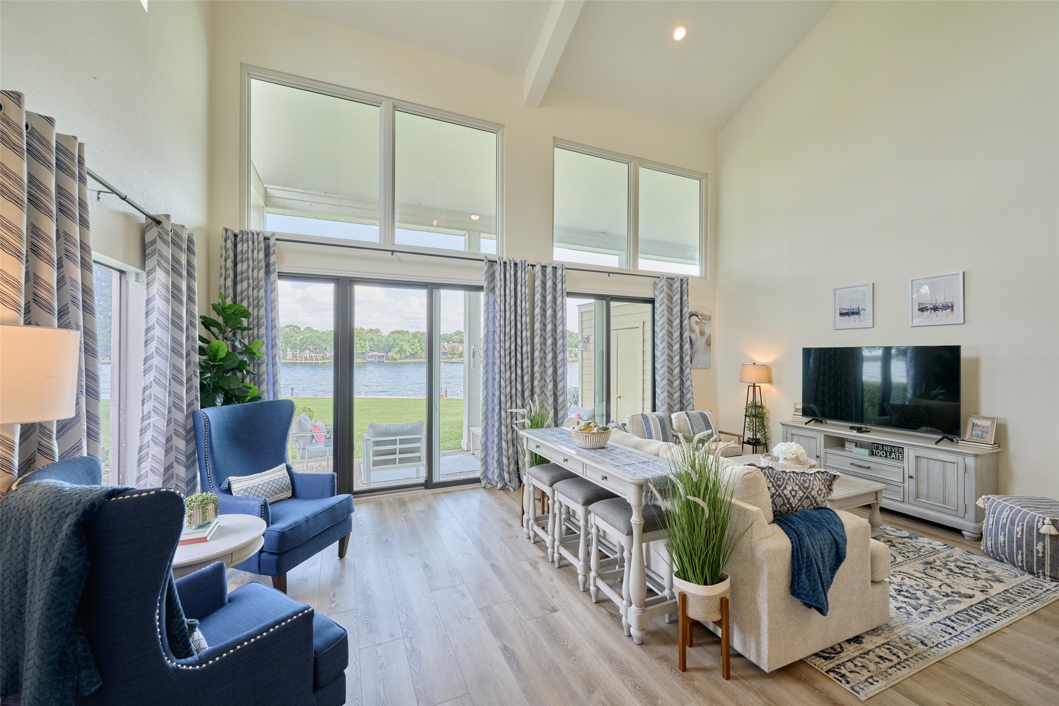73 April Point Drive South Montgomery, TX 77356 - Photo 7 of 42 Luxury vinyl plank flooring throughout the home offers durability for waterfront living!