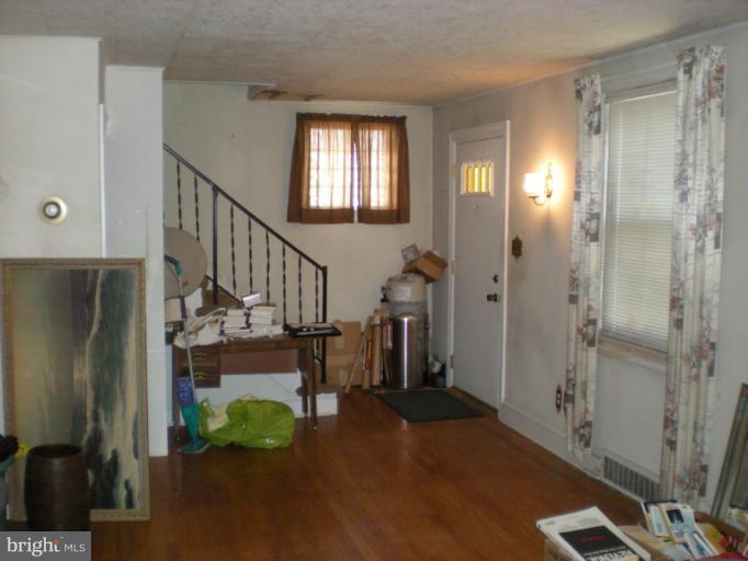 1233 Greystone Road Halethorpe, MD 21227 - Photo 1 of 30 a view of entryway and hall with wooden floor