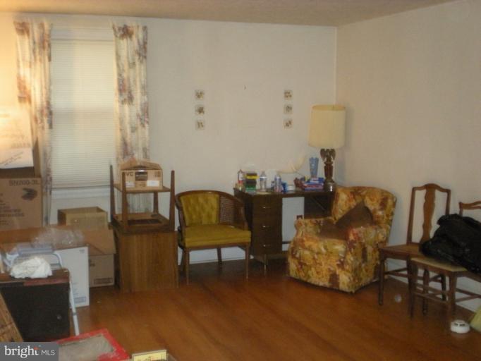 1233 Greystone Road Halethorpe, MD 21227 - Photo 24 of 30 a living room with furniture and a table