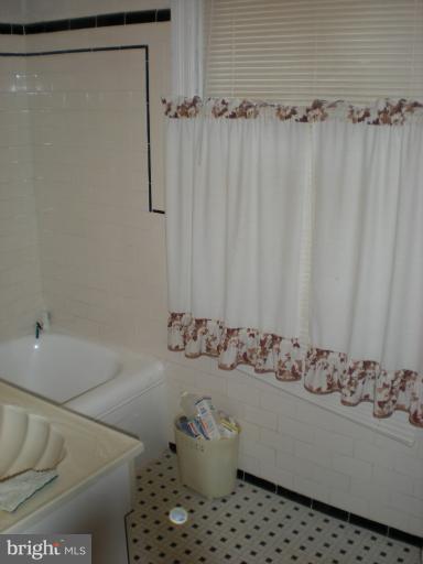 1233 Greystone Road Halethorpe, MD 21227 - Photo 26 of 30 a bathroom with a bathtub and shower