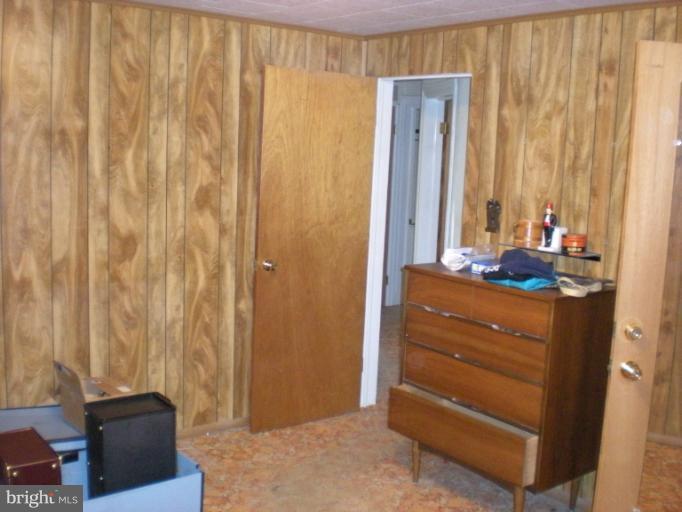 1233 Greystone Road Halethorpe, MD 21227 - Photo 27 of 30 a room with a bed and a dresser