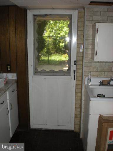 1233 Greystone Road Halethorpe, MD 21227 - Photo 4 of 30 a bathroom with a sink and a window