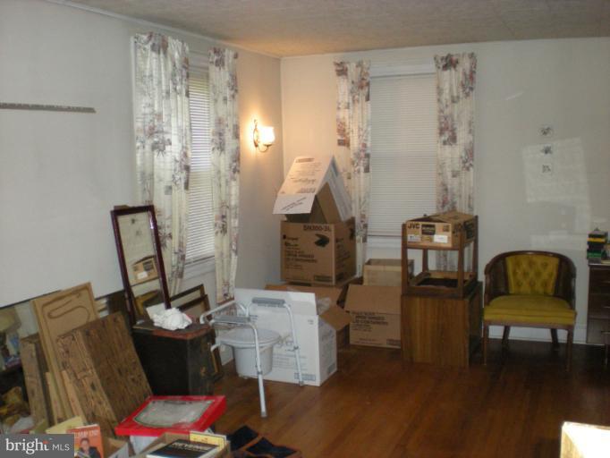 1233 Greystone Road Halethorpe, MD 21227 - Photo 7 of 30 a living room with furniture and a chair