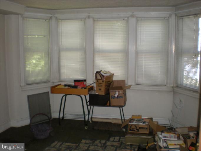 1233 Greystone Road Halethorpe, MD 21227 - Photo 8 of 30 a view of a workspace with furniture and a window