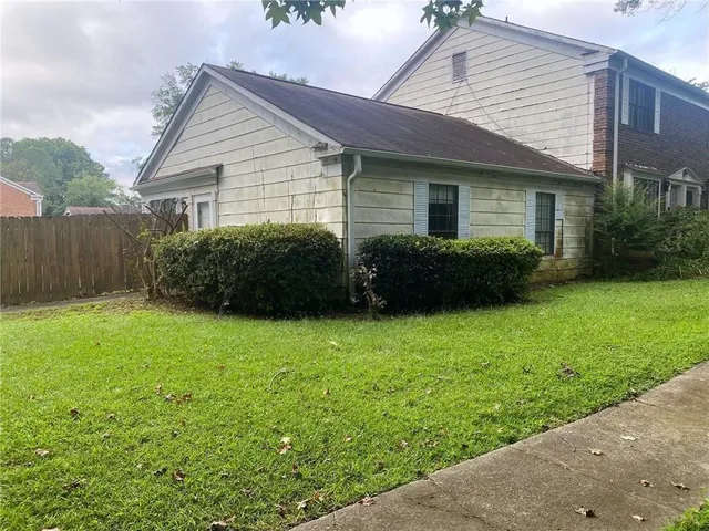 a view of a house with a garden