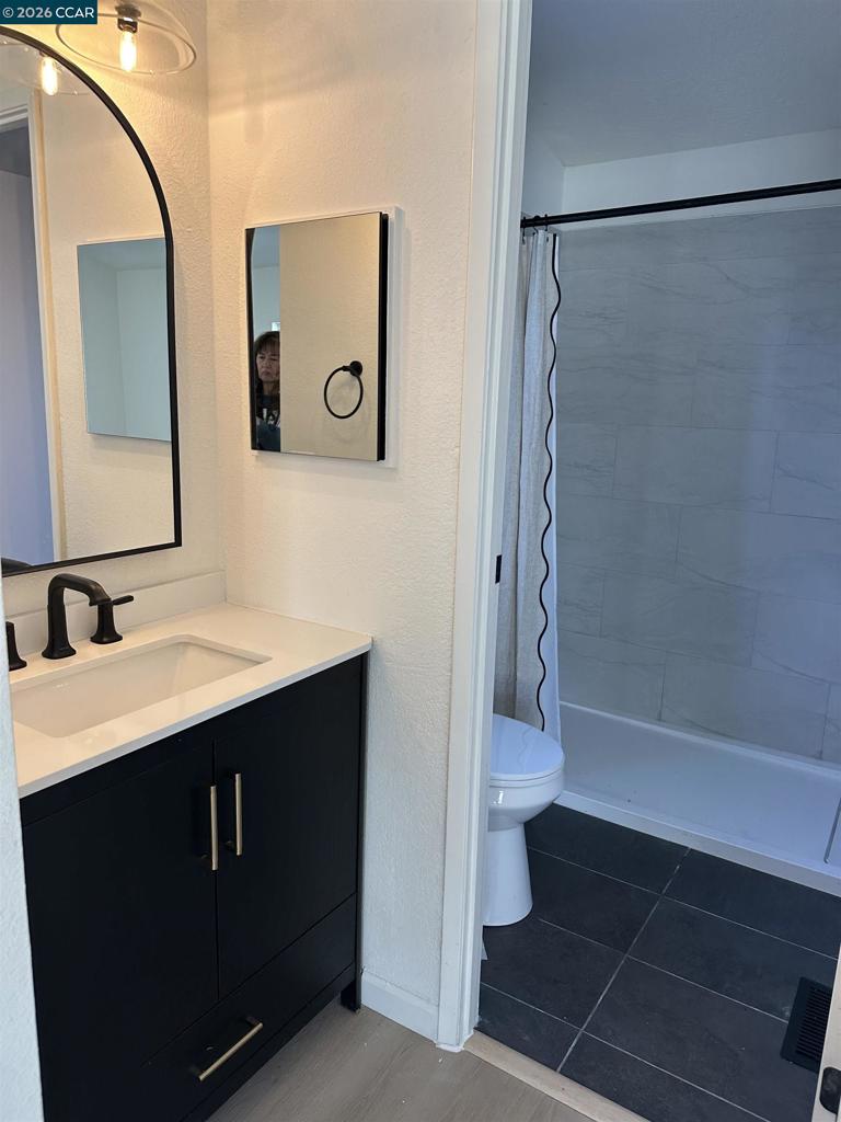 60 Wilson Way Milpitas, CA 95035 - Photo 10 of 22 a bathroom with a sink and a mirror