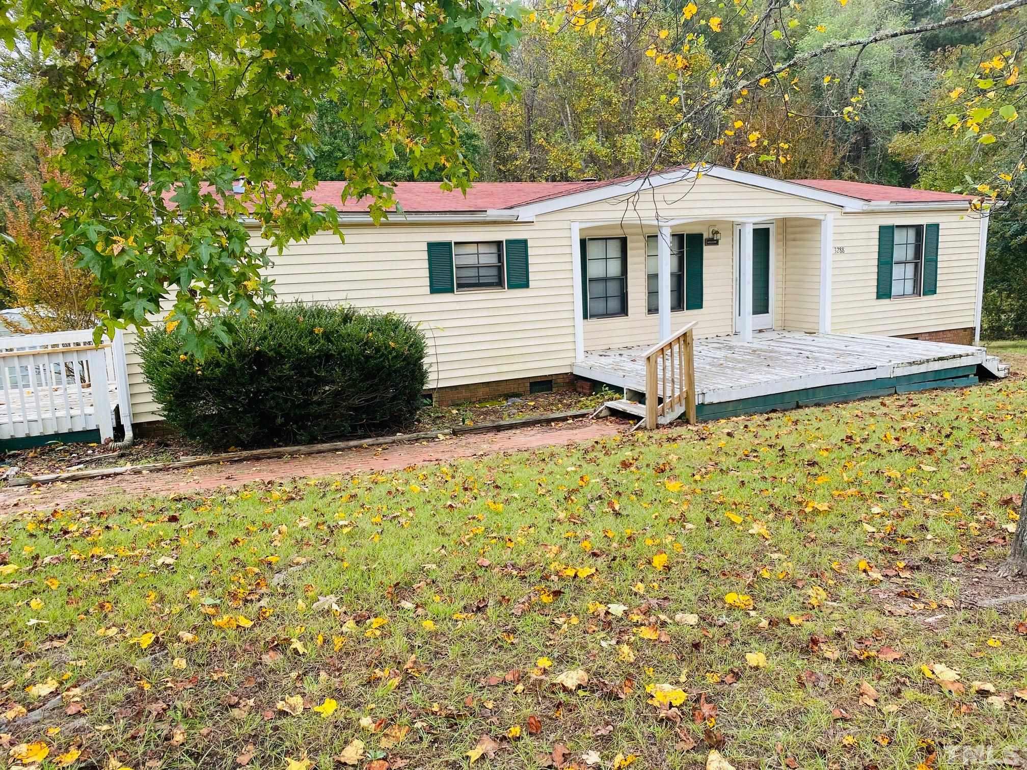 3288 Walters Road Creedmoor, NC 27522 - Photo 1 of 15 a front view of a house with a yard