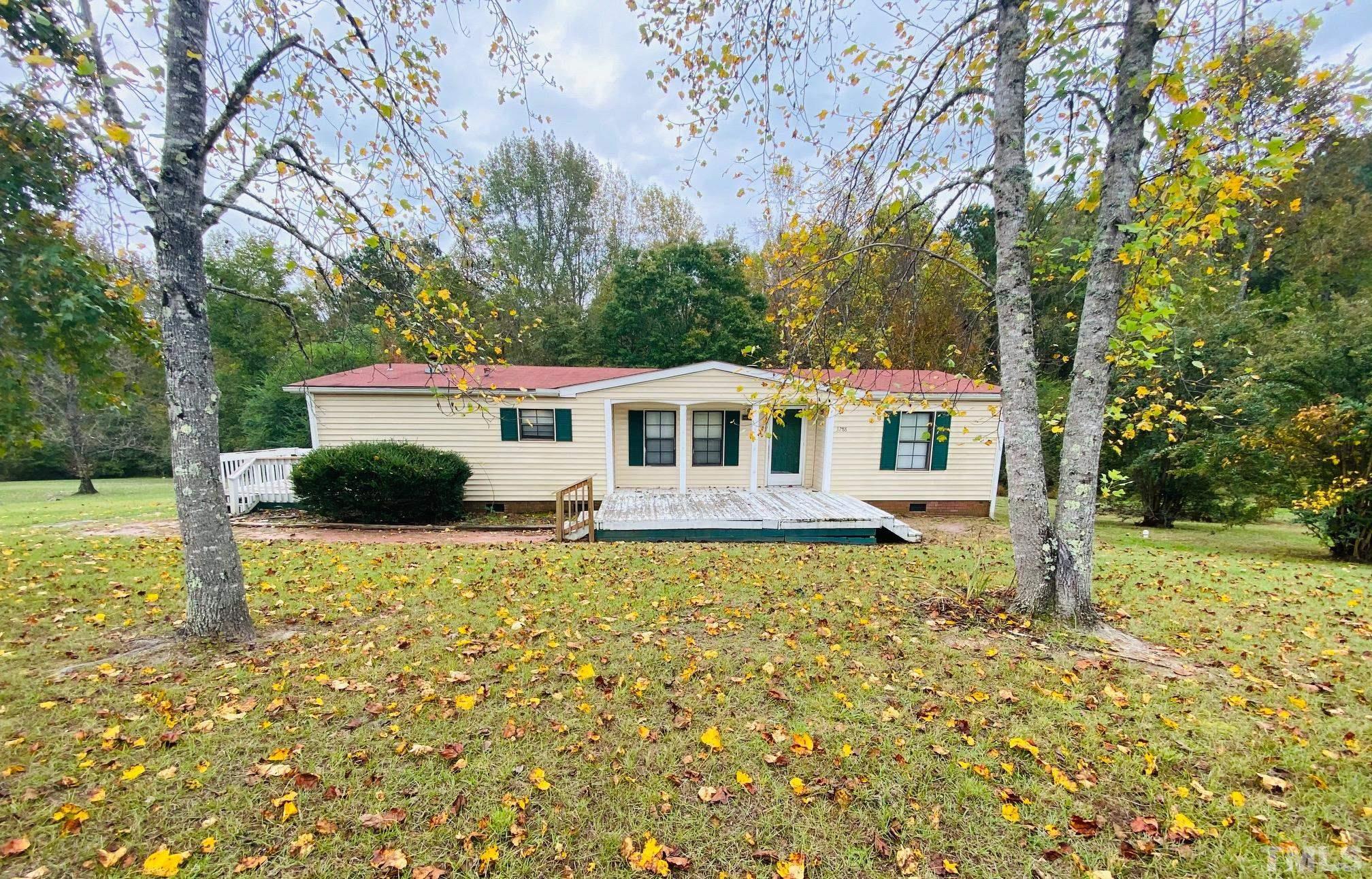 3288 Walters Road Creedmoor, NC 27522 - Photo 2 of 15 a front view of a house with a yard
