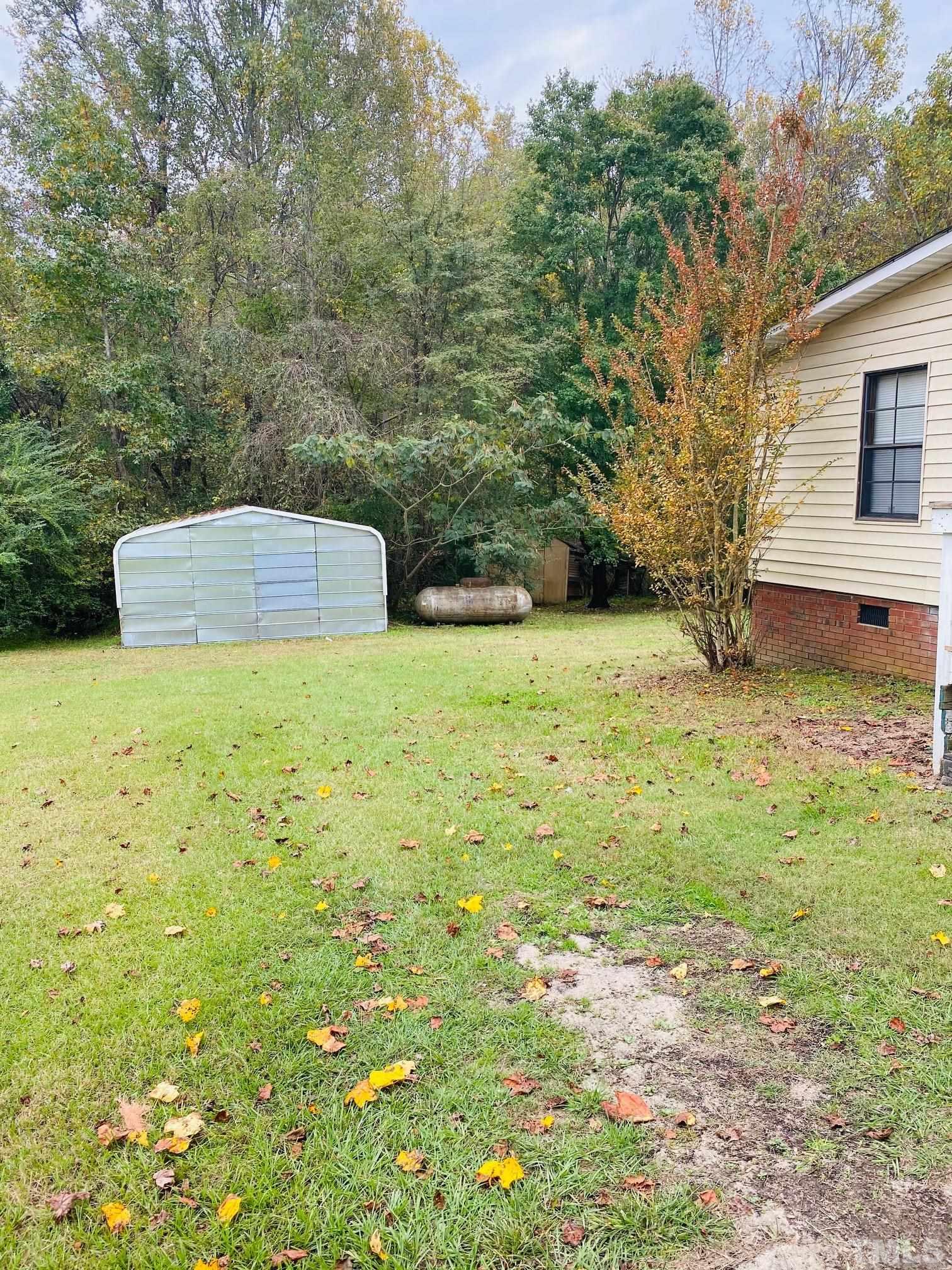 3288 Walters Road Creedmoor, NC 27522 - Photo 3 of 15 a view of a yard with large tree