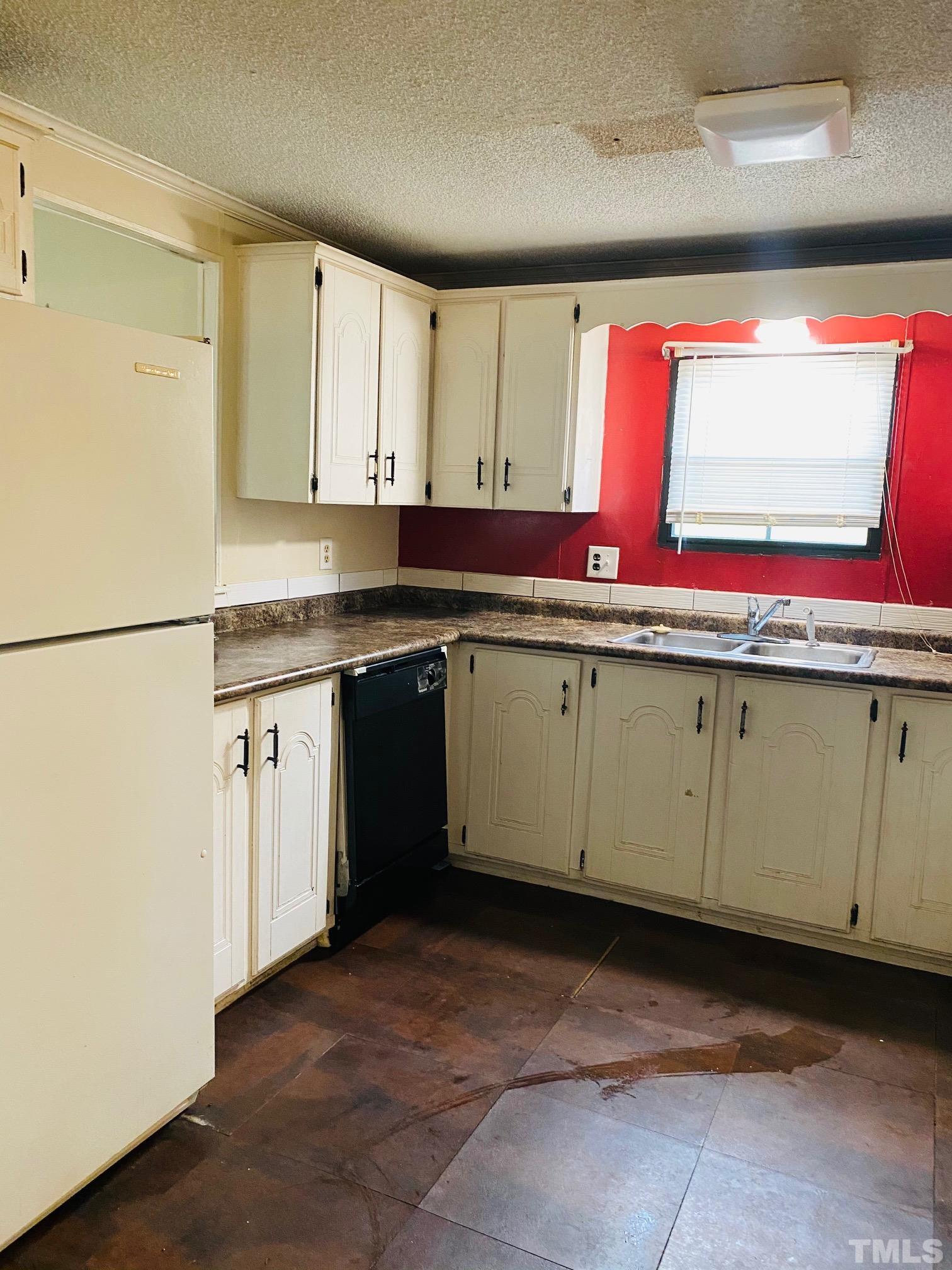 3288 Walters Road Creedmoor, NC 27522 - Photo 6 of 15 a kitchen with stainless steel appliances granite countertop a sink and a stove