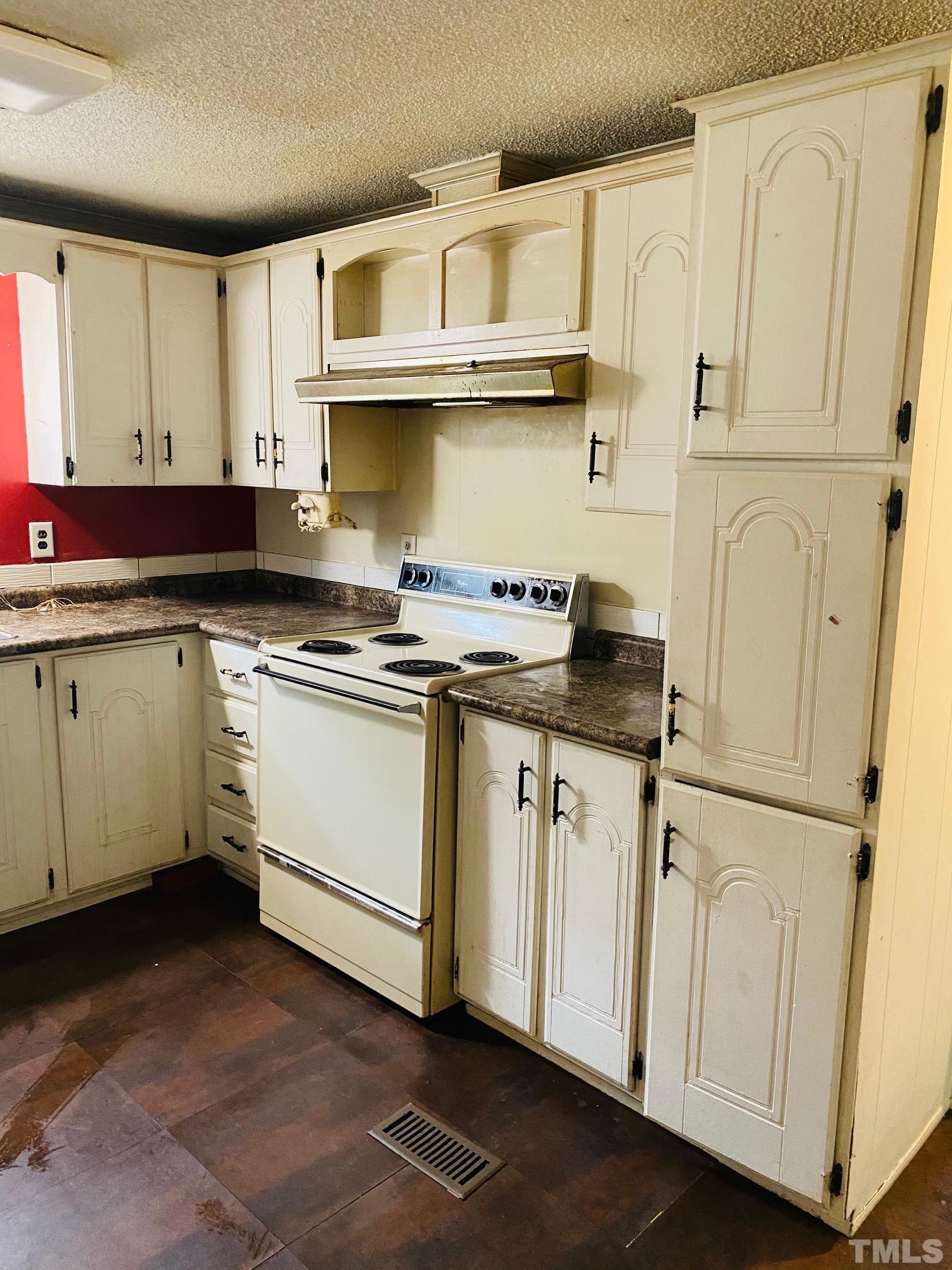 3288 Walters Road Creedmoor, NC 27522 - Photo 7 of 15 a kitchen with stainless steel appliances granite countertop white cabinets sink and a refrigerator