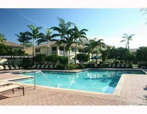 a house with swimming pool in front of it