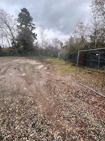 a backyard of a house with lots of green space