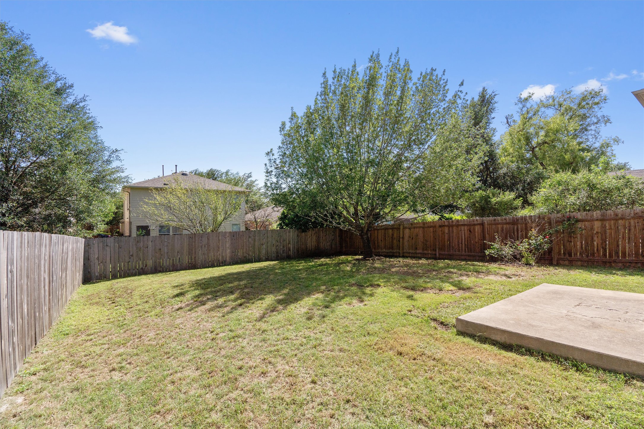5825 Silver Screen Drive Austin, TX 78747 - Photo 29 of 40 A spacious, enclosed yard provides ample room for outdoor activities and relaxation.
