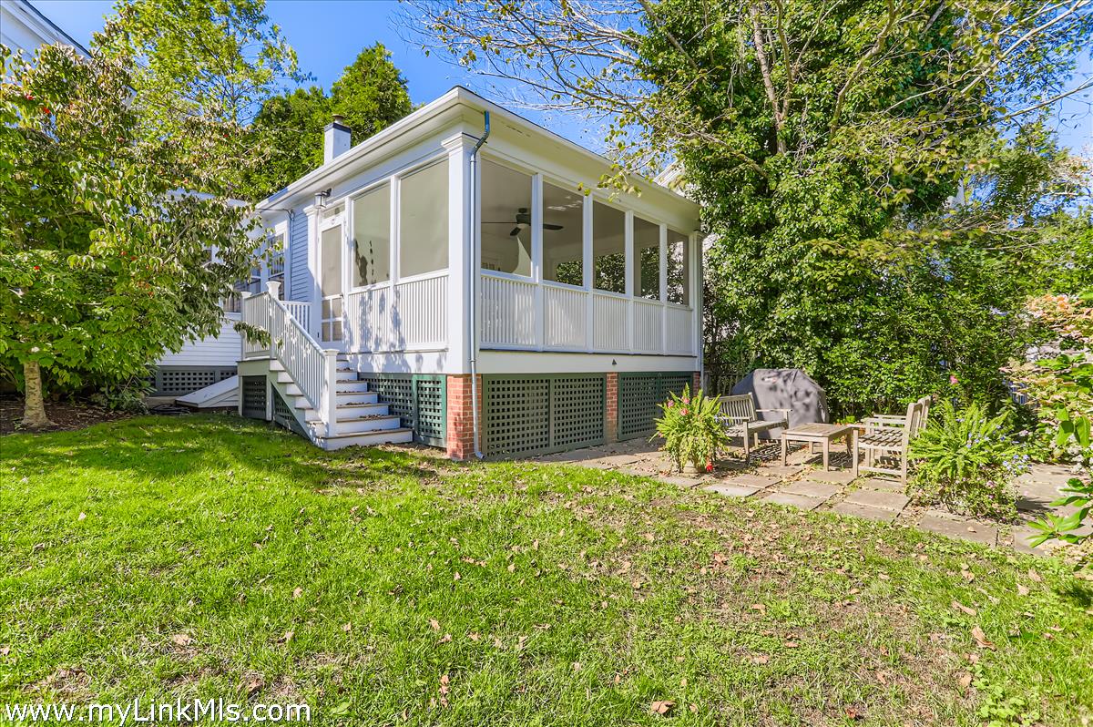 27 Spring Street Vineyard Haven, MA 02568 - Photo 57 of 58 a front view of a house with patio