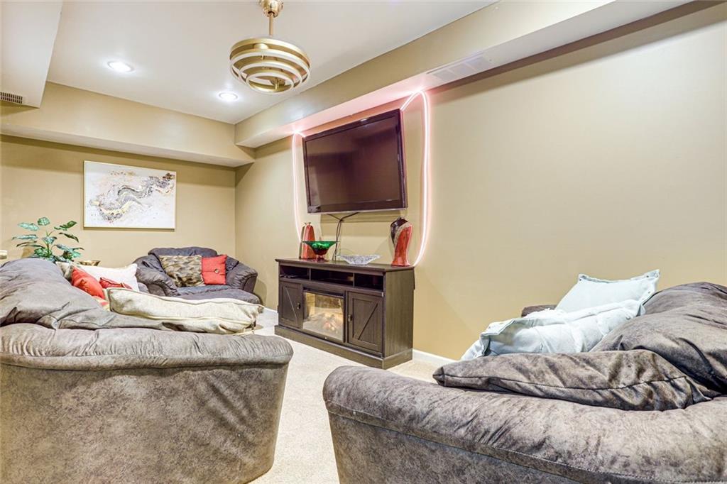 3595 Chastain Court Alpharetta, GA 30004 - Photo 13 of 13 a bedroom with a bed and a television