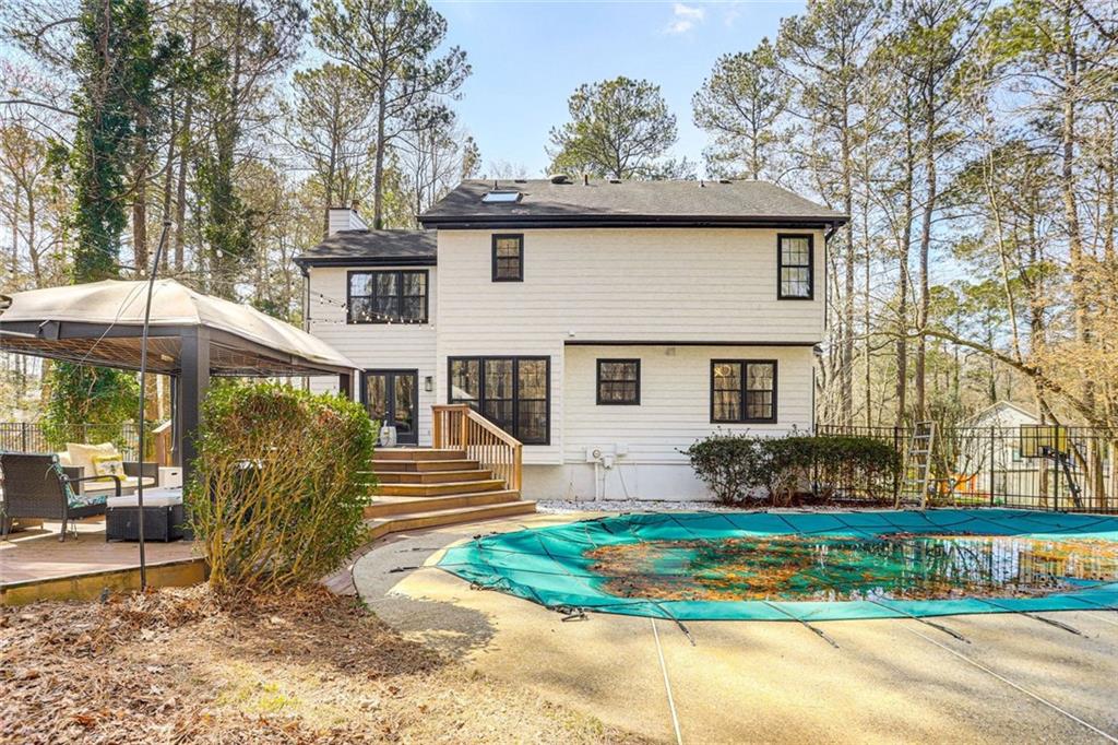 3595 Chastain Court Alpharetta, GA 30004 - Photo 2 of 13 a front view of a house with a yard