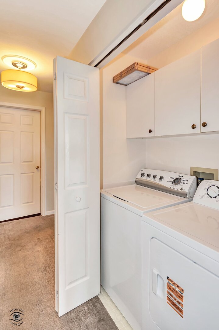 608 Huntington Court, Unit 608 Bourbonnais, IL 60914 - Photo 15 of 27 a utility room with closet and mirror