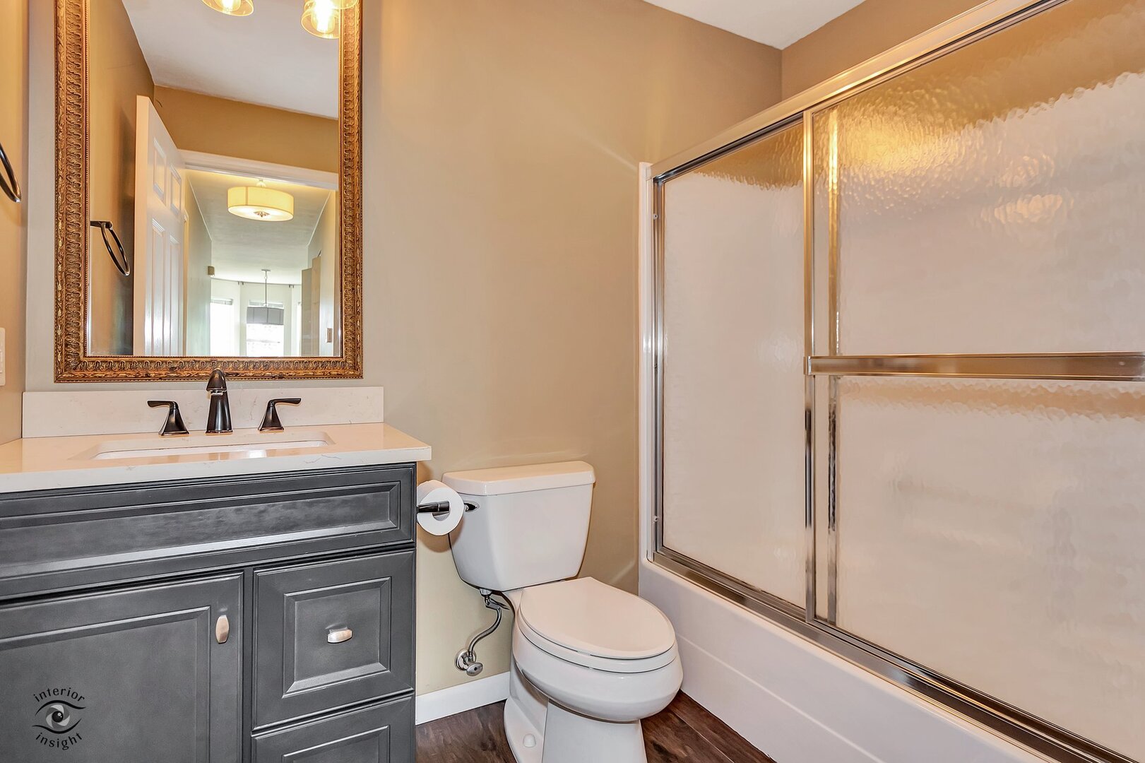 608 Huntington Court, Unit 608 Bourbonnais, IL 60914 - Photo 19 of 27 a bathroom with a granite countertop sink toilet and shower
