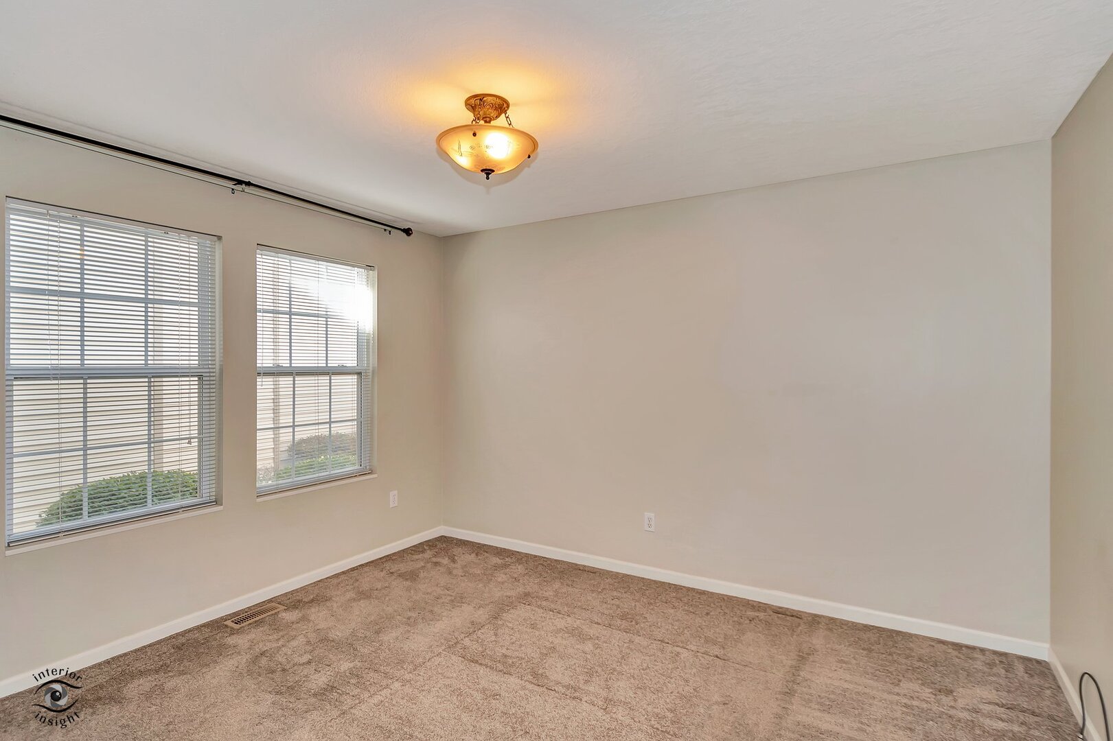 608 Huntington Court, Unit 608 Bourbonnais, IL 60914 - Photo 20 of 27 a view of empty room with wooden floor