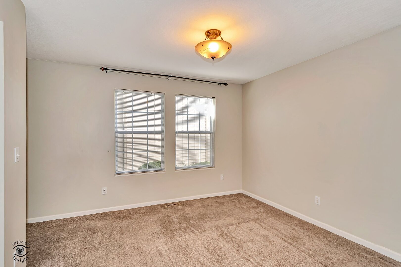 608 Huntington Court, Unit 608 Bourbonnais, IL 60914 - Photo 21 of 27 an empty room with a window