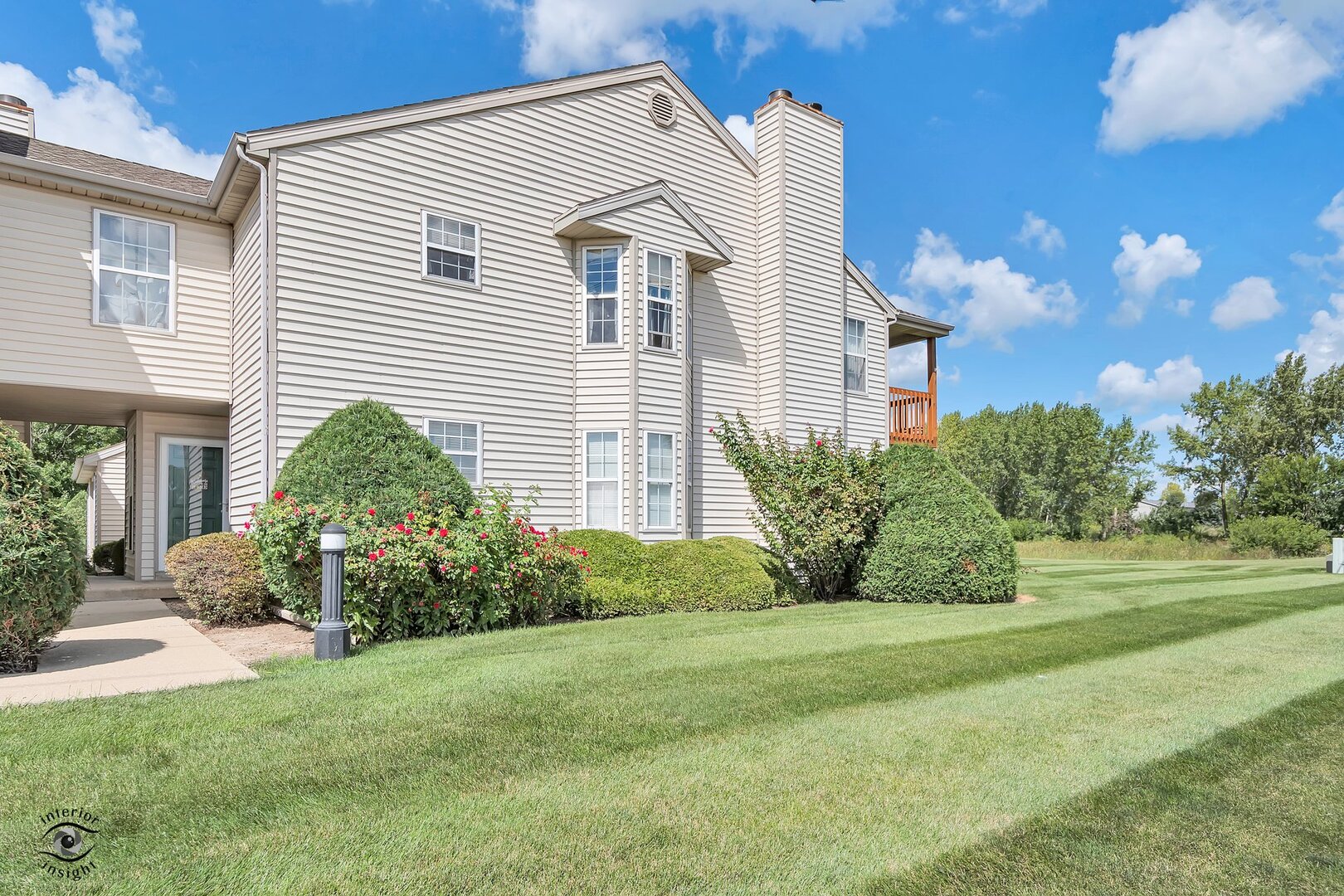 608 Huntington Court, Unit 608 Bourbonnais, IL 60914 - Photo 27 of 27 a view of a house with backyard and garden