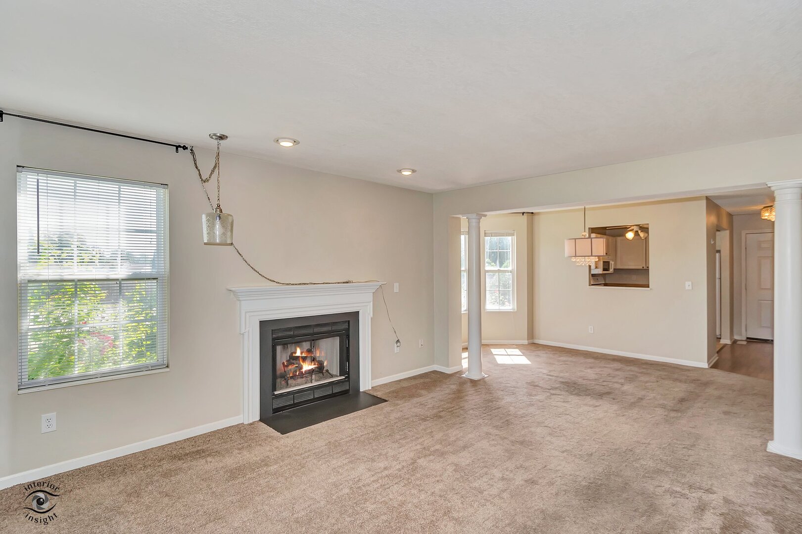 608 Huntington Court, Unit 608 Bourbonnais, IL 60914 - Photo 7 of 27 a view of an empty room with window and fireplace