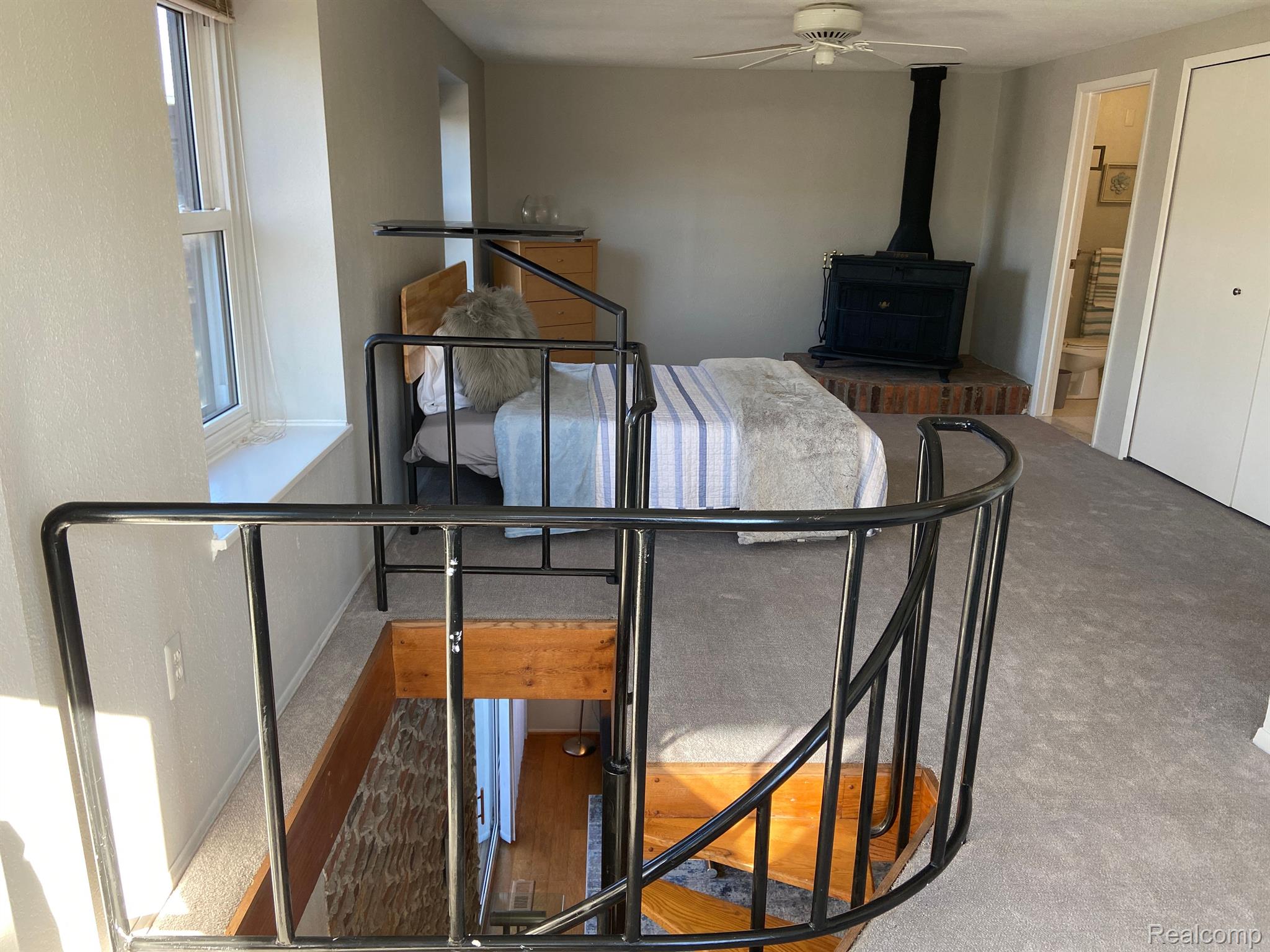 5045 North Crooks Road, Unit 20 Royal Oak, MI 48073 - Photo 26 of 46 Spiral Staircase entrance to Primary Bedroom.