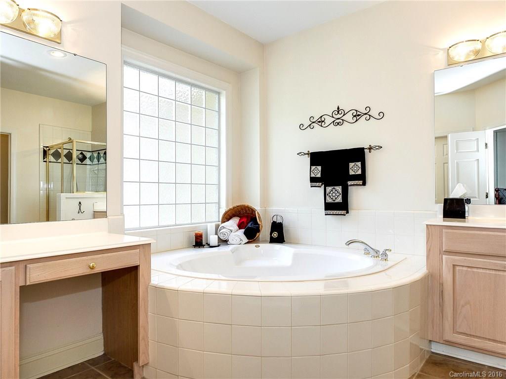 10622 Back Ridge Road Charlotte, NC 28277 - Photo 14 of 24 a bathroom with a sink and a mirror