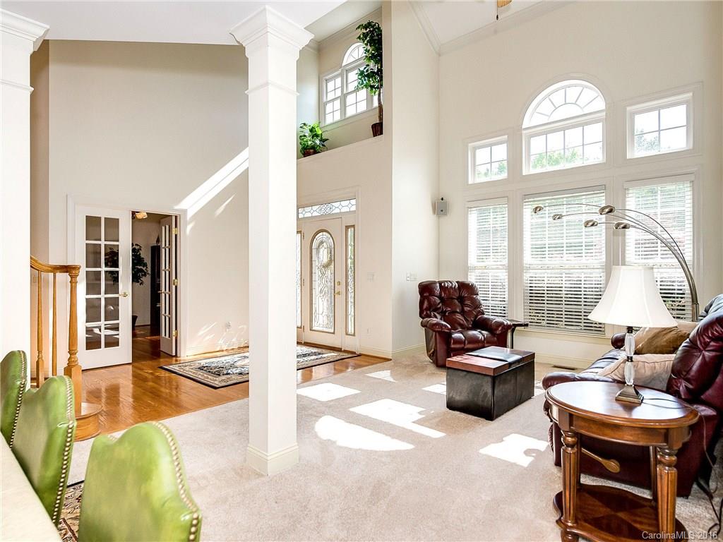 10622 Back Ridge Road Charlotte, NC 28277 - Photo 4 of 24 a living room with furniture a window and gym equipment