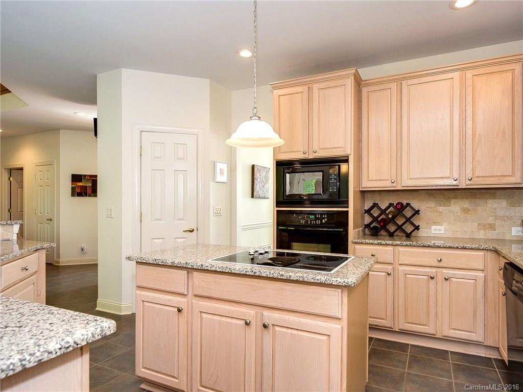 10622 Back Ridge Road Charlotte, NC 28277 - Photo 8 of 24 a kitchen with granite countertop a sink stainless steel appliances and white cabinets