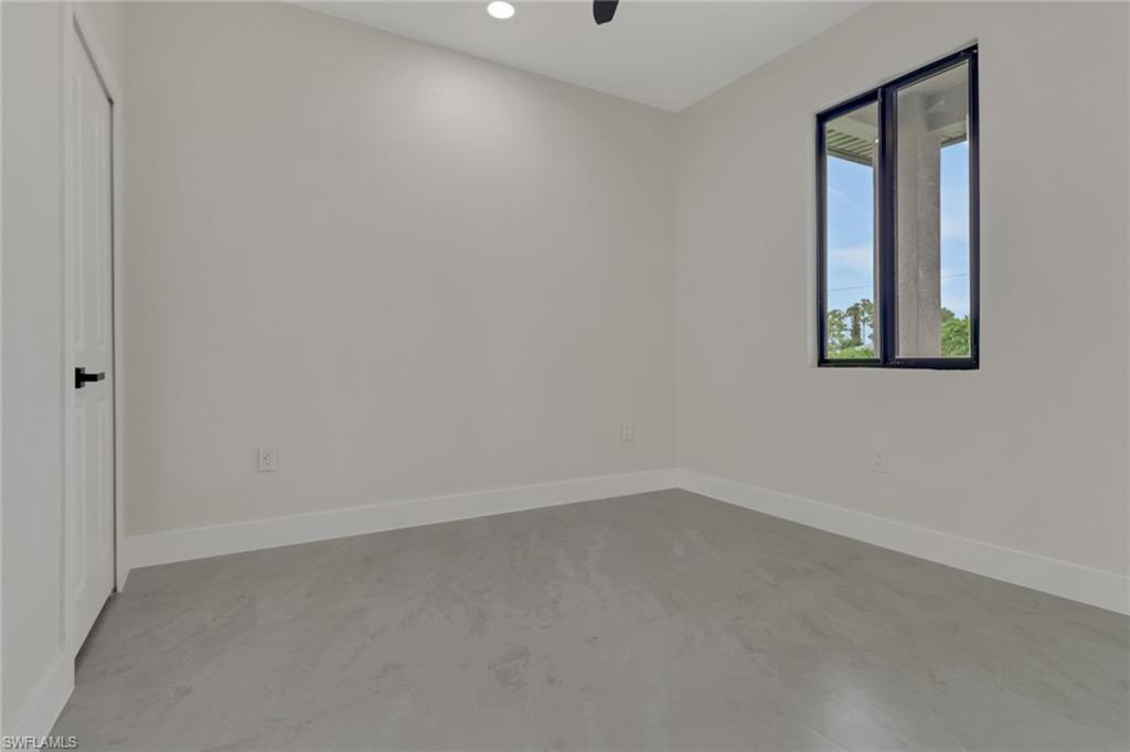 4501-4503 15th Street Southwest Lehigh Acres, FL 33973 - Photo 34 of 50 an empty room with windows and closet