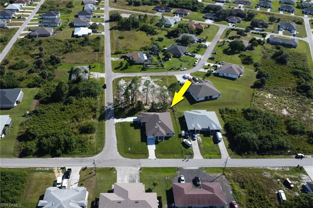 4501-4503 15th Street Southwest Lehigh Acres, FL 33973 - Photo 42 of 50 an aerial view of houses with yard