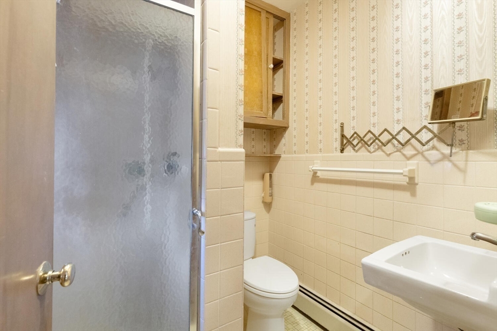 4 R Forest Street Peabody, MA 01960 - Photo 21 of 33 a bathroom with a sink a toilet and shower