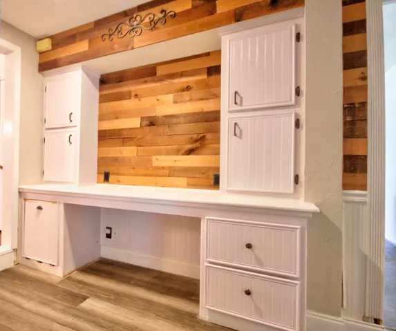 a bathroom with a sink and a large mirror