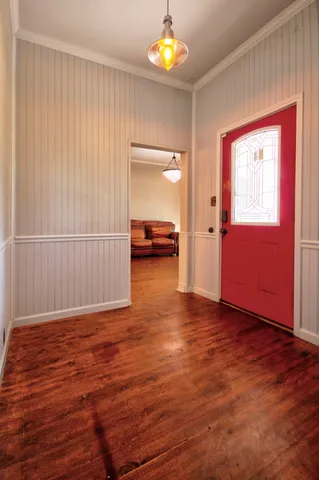 a living room with furniture a ceiling fan and a rug