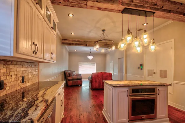 a kitchen with a stove oven and sink