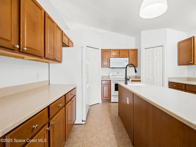 a kitchen with stainless steel appliances granite countertop a sink and cabinets